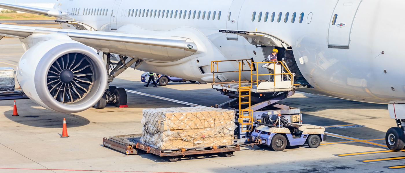 Cargo being loaded onto an aircraft for expedited air freight shipping.